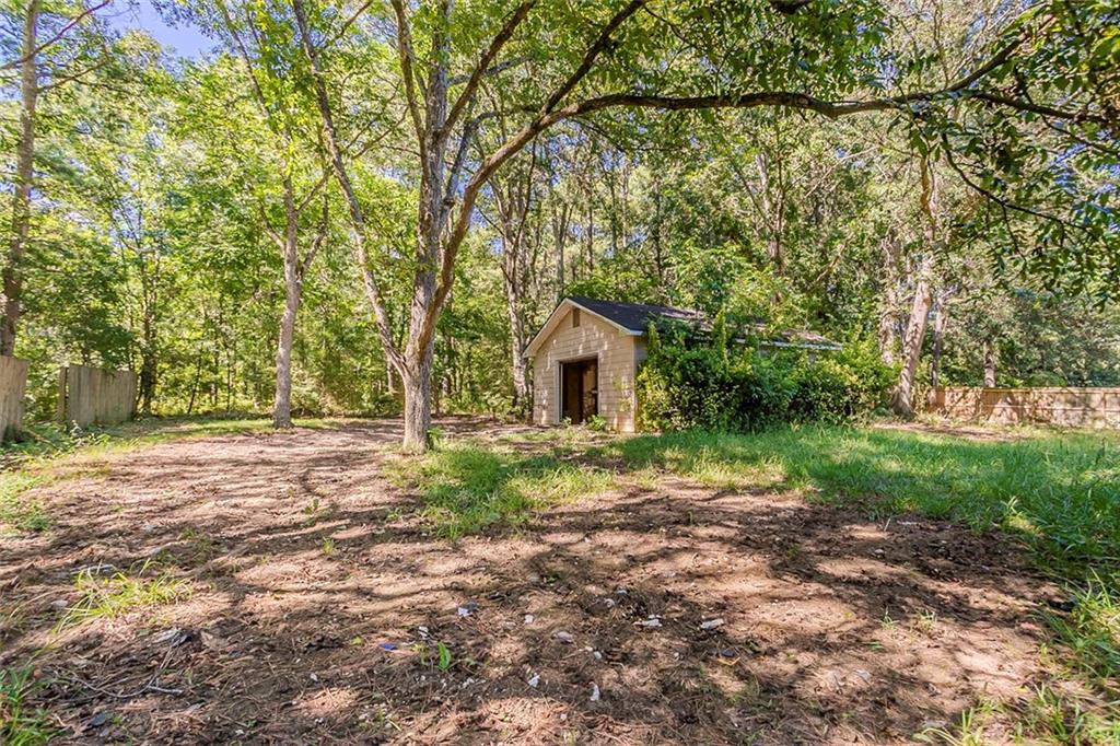 926 Bell Road Southeast Conyers, GA 30094 - Photo 28 of 30 a backyard of a house with lots of green space