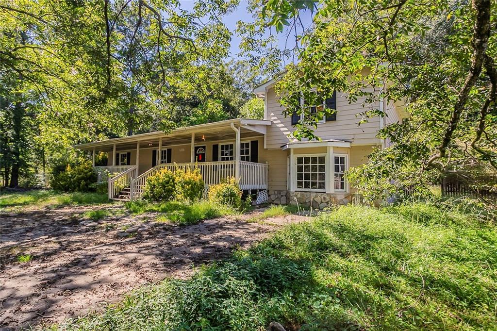 926 Bell Road Southeast Conyers, GA 30094 - Photo 3 of 32 a view of front of house with a yard