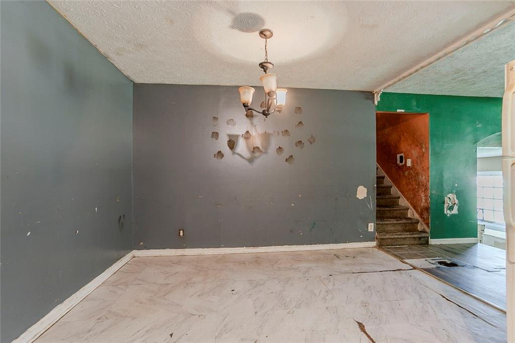 926 Bell Road Southeast Conyers, GA 30094 - Photo 8 of 32 a view of a hallway with wooden floor and staircase