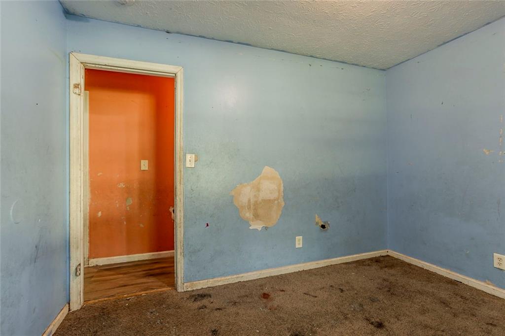 926 Bell Road Southeast Conyers, GA 30094 - Photo 10 of 30 an empty room with a window