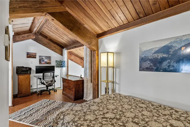 a bedroom with furniture and a window