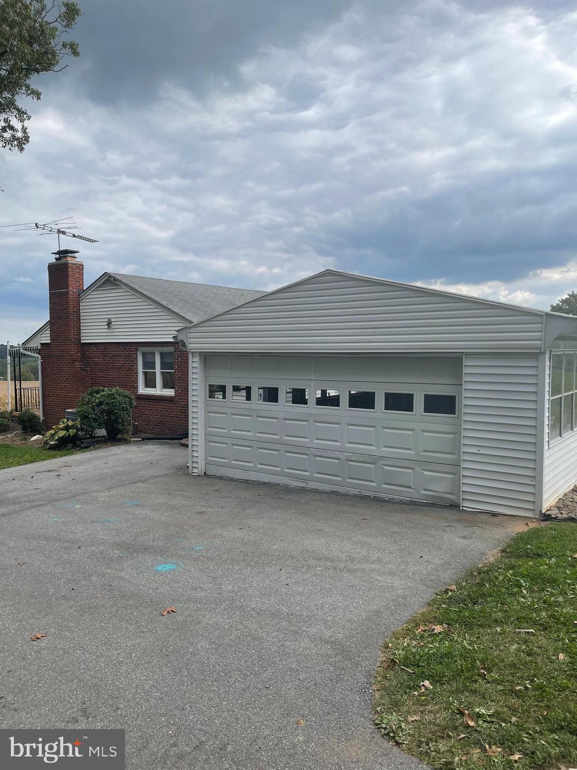 1670 Florence Road Mount Airy, MD 21771 - Photo 8 of 20 a front view of a house with garage