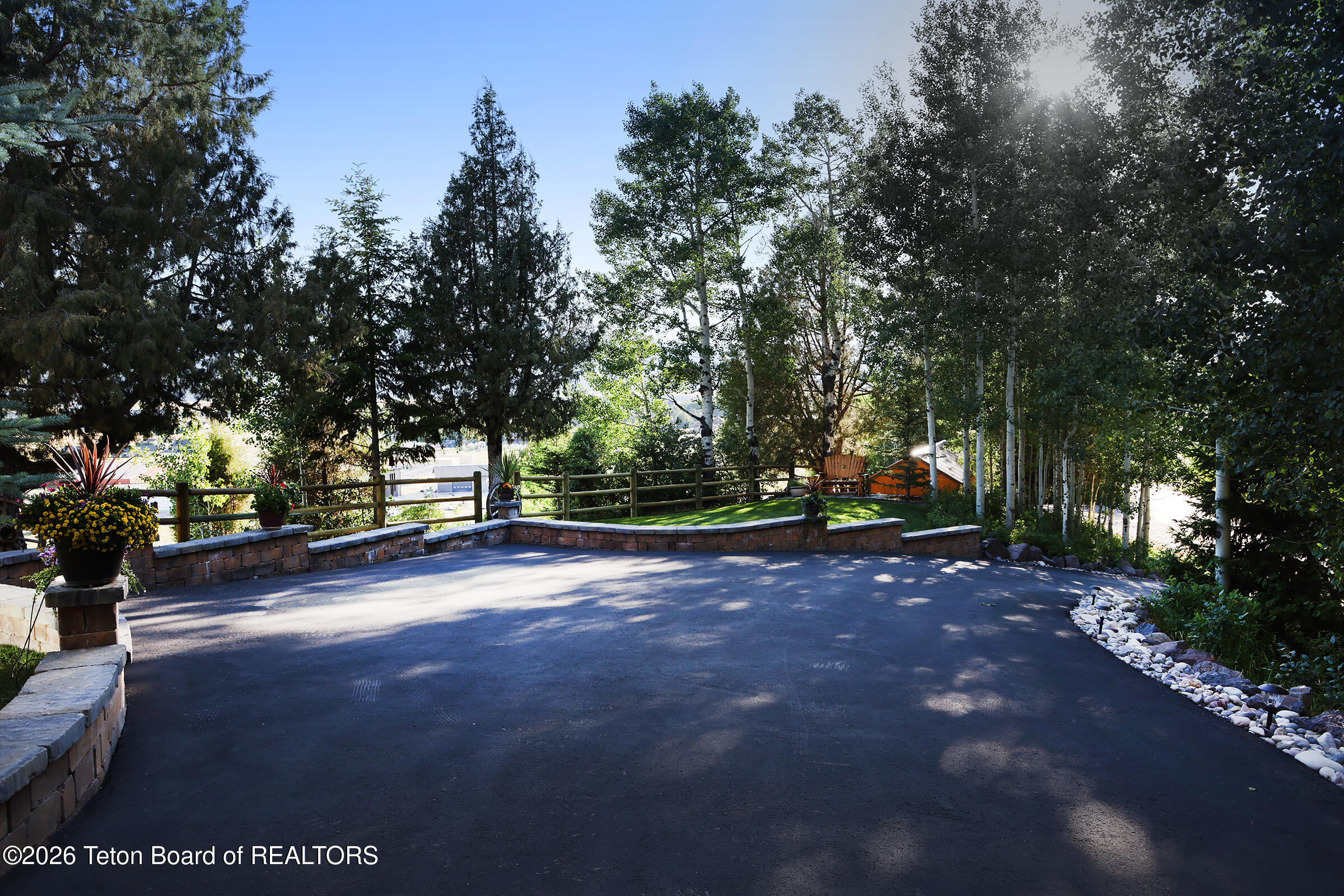 166 Aspen Ridge Trail Alpine, WY 83128 - Photo 47 of 50 45-166_Aspen_Ridge_Trail_FrontDriveExter