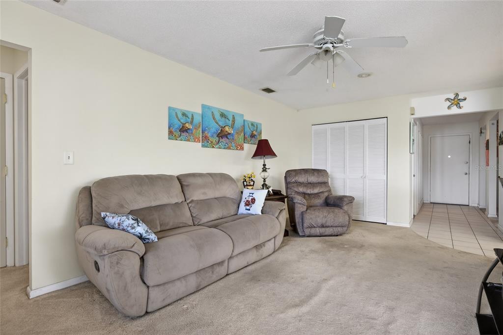 2484 Broad Ranch Drive Port Charlotte, FL 33948 - Photo 11 of 43 a living room with furniture and a ceiling fan