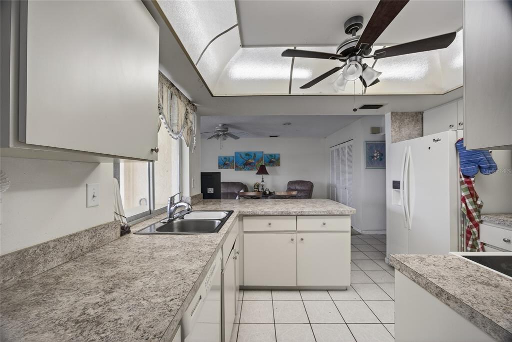 2484 Broad Ranch Drive Port Charlotte, FL 33948 - Photo 14 of 43 a kitchen with a sink appliances and cabinets