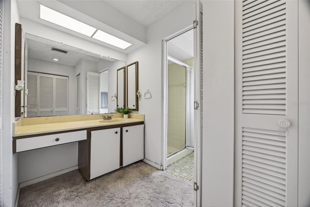 2484 Broad Ranch Drive Port Charlotte, FL 33948 - Photo 18 of 43 a spacious bathroom with a double vanity sink and a mirror
