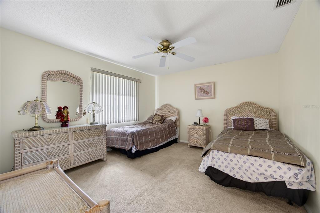2484 Broad Ranch Drive Port Charlotte, FL 33948 - Photo 20 of 43 a bedroom with two beds and windows
