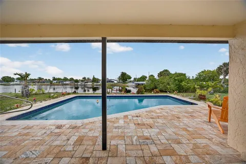 a view of swimming pool from a balcony