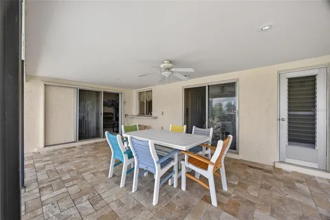 a view of a dining room with furniture and window
