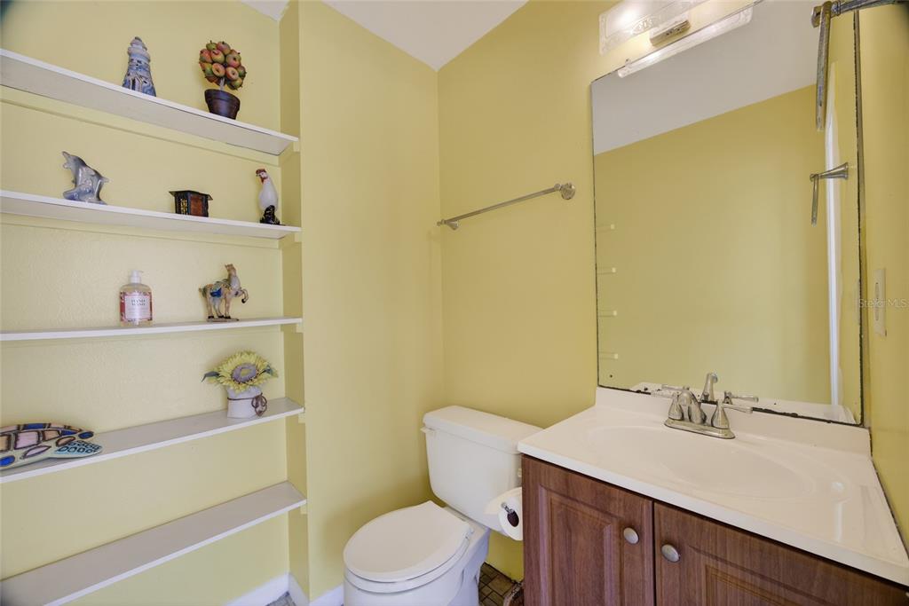 2484 Broad Ranch Drive Port Charlotte, FL 33948 - Photo 27 of 43 a bathroom with a sink a toilet and a mirror