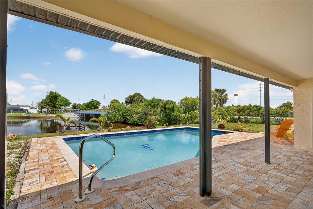 2484 Broad Ranch Drive Port Charlotte, FL 33948 - Photo 3 of 43 a view of a swimming pool with a patio