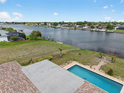 an aerial view of a house with a lake view