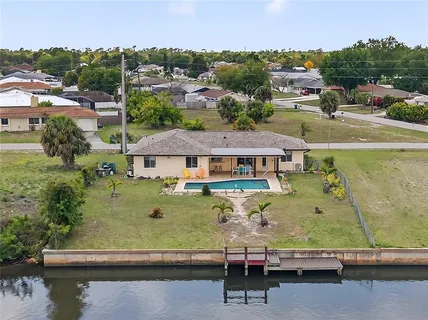 a view of a swimming pool with a lake view