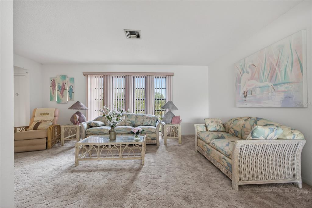 2484 Broad Ranch Drive Port Charlotte, FL 33948 - Photo 5 of 43 a living room with furniture and a large window