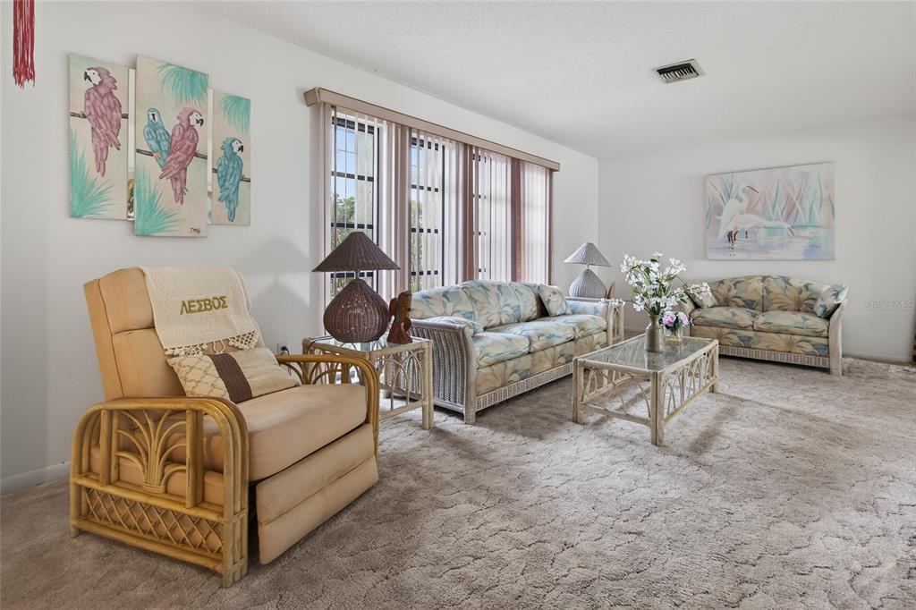 2484 Broad Ranch Drive Port Charlotte, FL 33948 - Photo 7 of 43 a living room with furniture and a large window