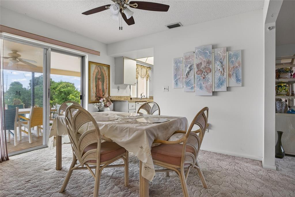 2484 Broad Ranch Drive Port Charlotte, FL 33948 - Photo 8 of 43 a view of a dining room with furniture window and outside view