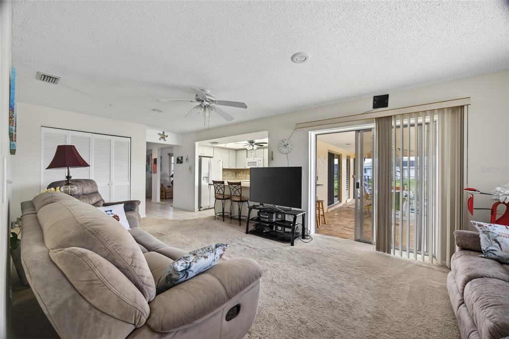 2484 Broad Ranch Drive Port Charlotte, FL 33948 - Photo 10 of 43 a living room with furniture and a flat screen tv