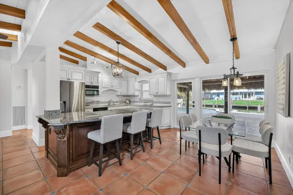 a kitchen with sink cabinets and microwave