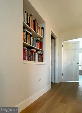 a view of an empty room with shelves
