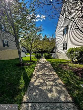 a view of a building with a yard