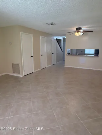 a view of a livingroom with a kitchen