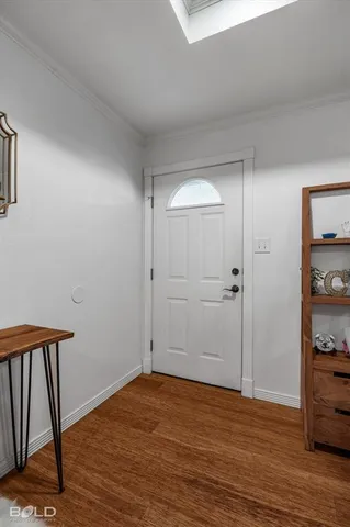 a view of a room with wooden floor