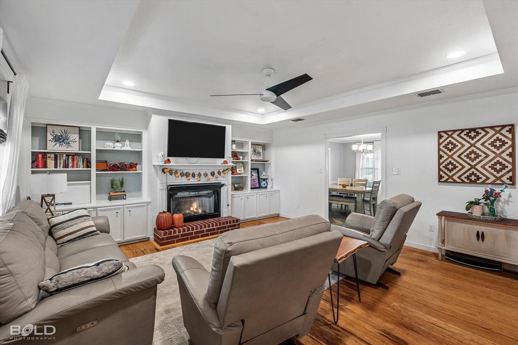 3804 Farmridge Road Keithville, LA 71047 - Photo 13 of 36 a living room with furniture a fireplace and a flat screen tv