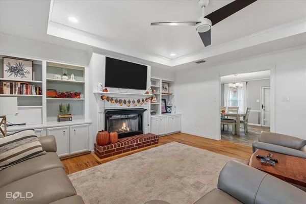 a living room with furniture and a fireplace
