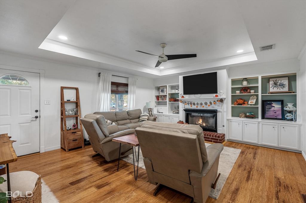 3804 Farmridge Road Keithville, LA 71047 - Photo 16 of 36 a living room with furniture a fireplace and a flat screen tv