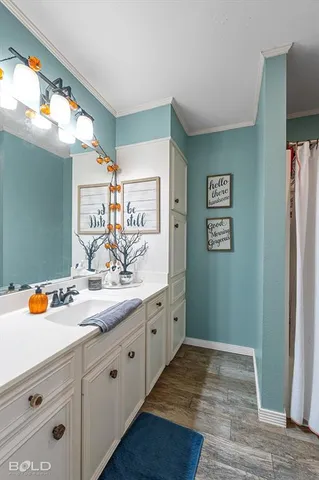 a spacious bedroom with a bed and a window