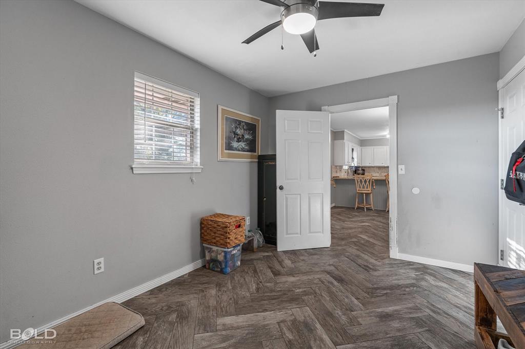 3804 Farmridge Road Keithville, LA 71047 - Photo 35 of 36 a view of a hallway with a livingroom with furniture