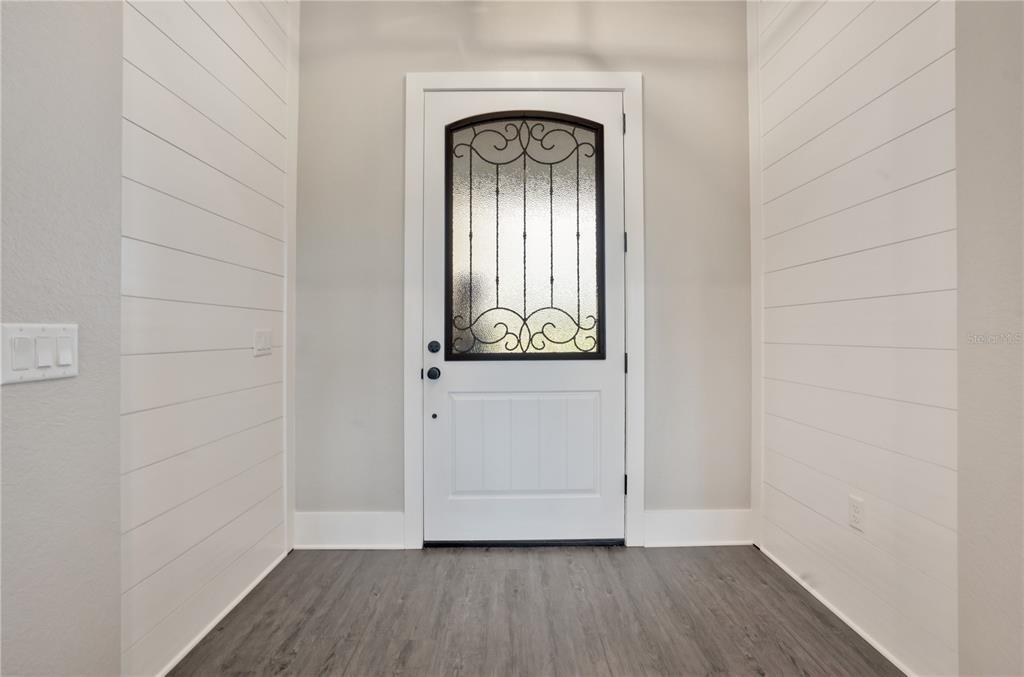 440 Palma Ceia Road Winter Haven, FL 33884 - Photo 11 of 78 a view of front door with wooden floor
