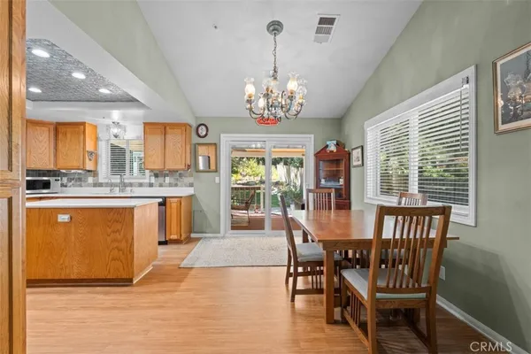 a kitchen with a sink a counter top space and stainless steel appliances