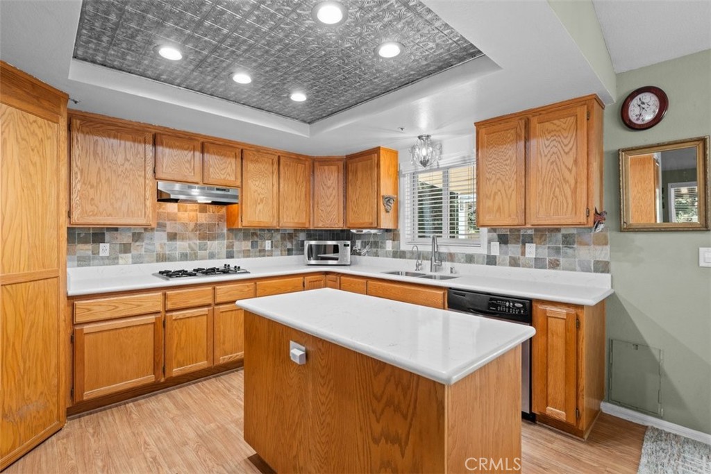 1585 Linnet Road Wrightwood, CA 92397 - Photo 14 of 38 a kitchen with stainless steel appliances granite countertop a sink a stove and a refrigerator