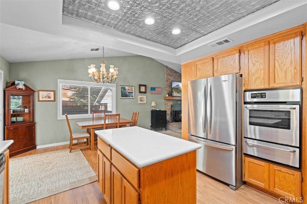 1585 Linnet Road Wrightwood, CA 92397 - Photo 15 of 38 a kitchen with stainless steel appliances a refrigerator and a stove top oven