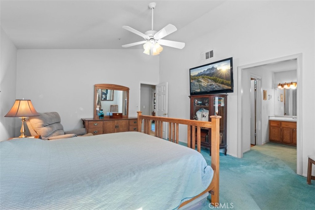 1585 Linnet Road Wrightwood, CA 92397 - Photo 17 of 38 a bedroom with a bed and a flat screen tv