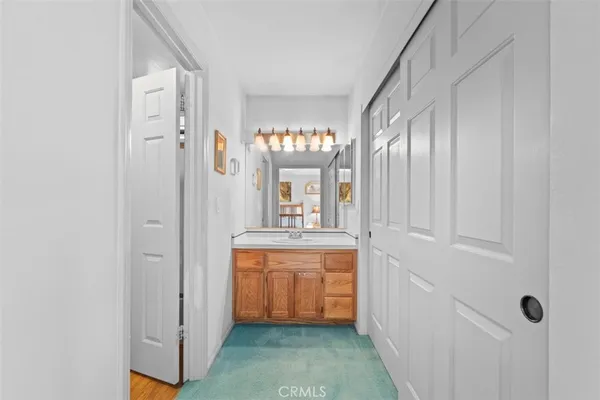 a bedroom with a bed and a cabinets