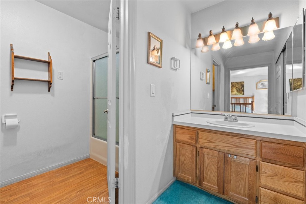 1585 Linnet Road Wrightwood, CA 92397 - Photo 26 of 38 a bathroom with a sink and a mirror