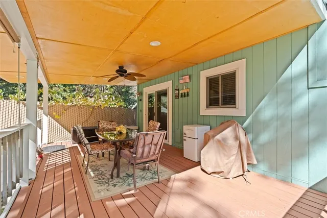 a view of a yard with plants and trees