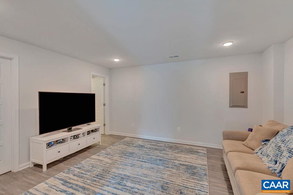 2176 Avinity Loop Charlottesville, VA 22902 - Photo 4 of 50 a living room with furniture and a flat screen tv