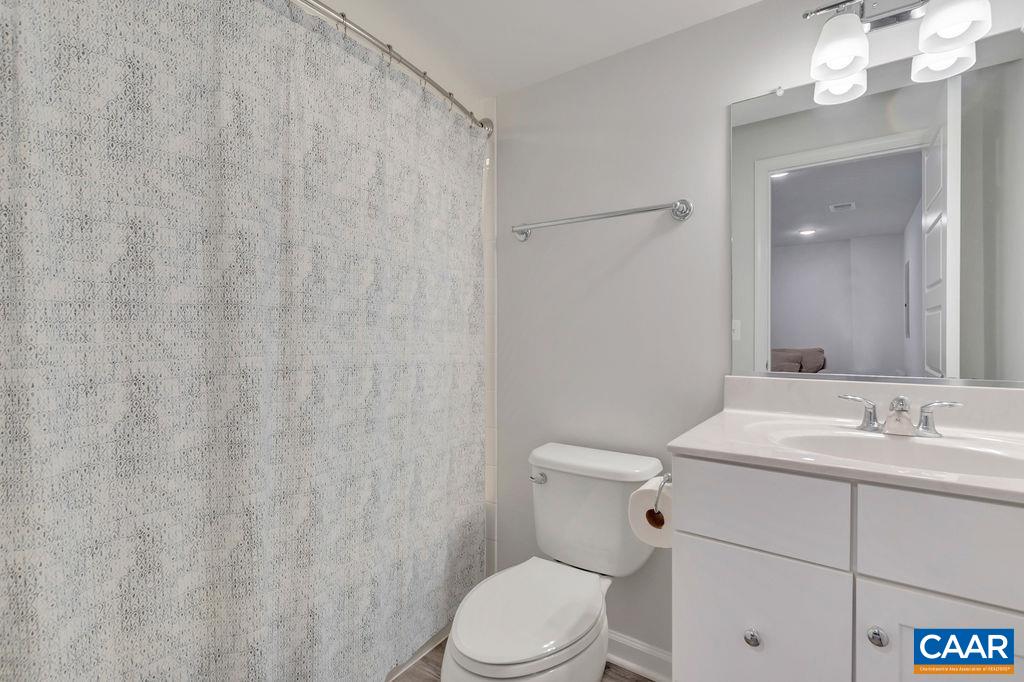 2176 Avinity Loop Charlottesville, VA 22902 - Photo 6 of 50 a bathroom with a sink a toilet and a mirror