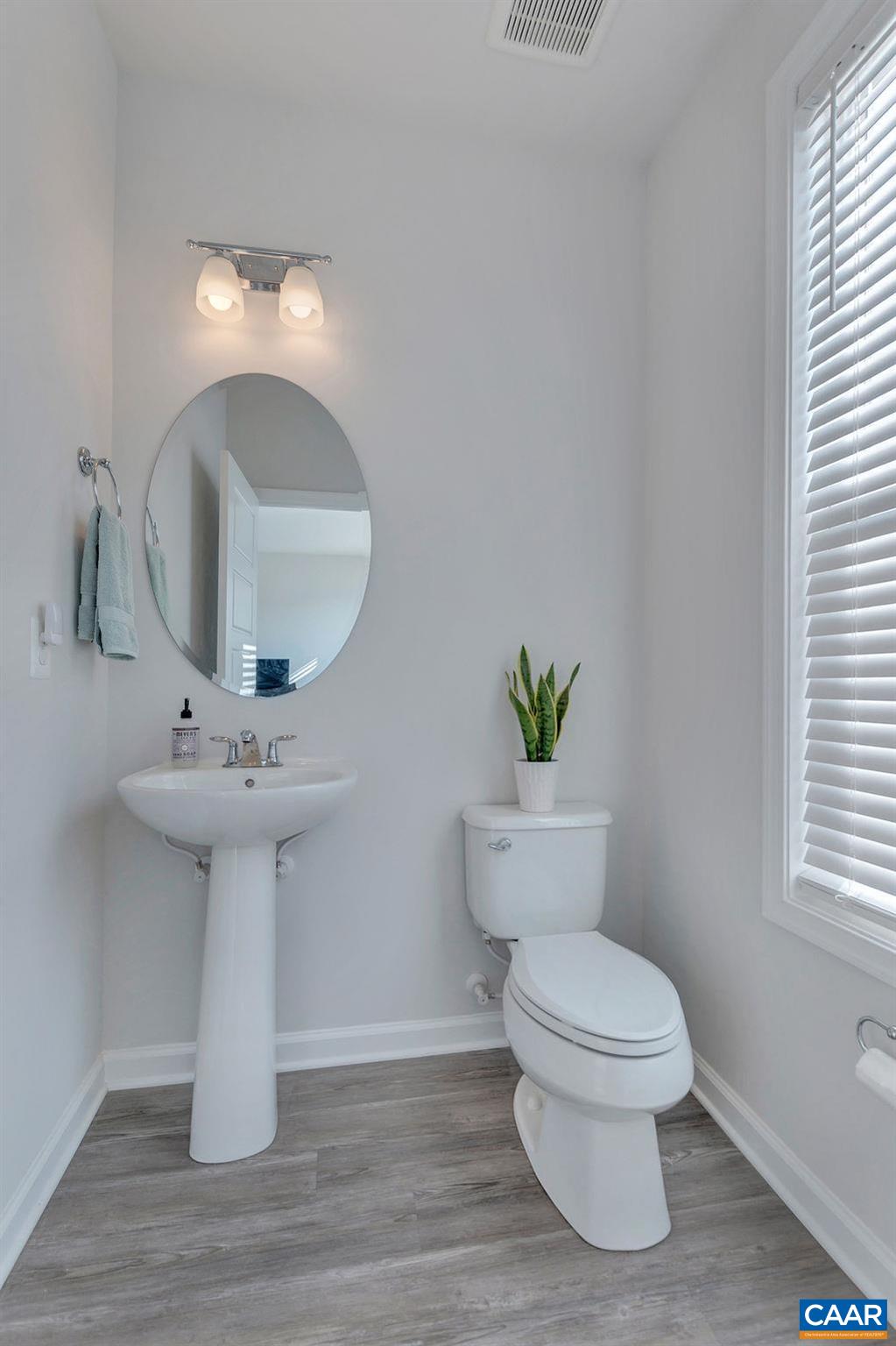 2176 Avinity Loop Charlottesville, VA 22902 - Photo 10 of 50 a bathroom with a toilet sink and mirror