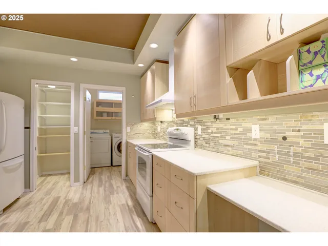 a bathroom with a sink a toilet a mirror and shower