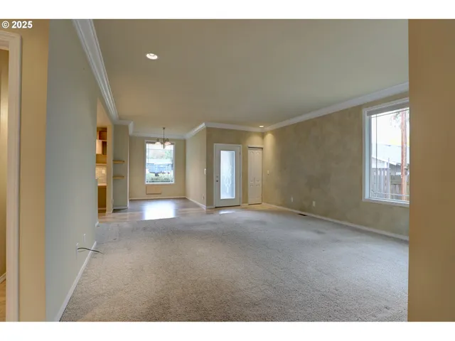a view of a yard with a house and a tree