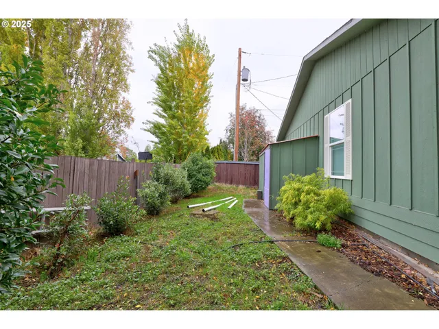 a backyard of a house with lots of green space