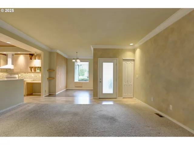 a view of a kitchen with a sink and a window