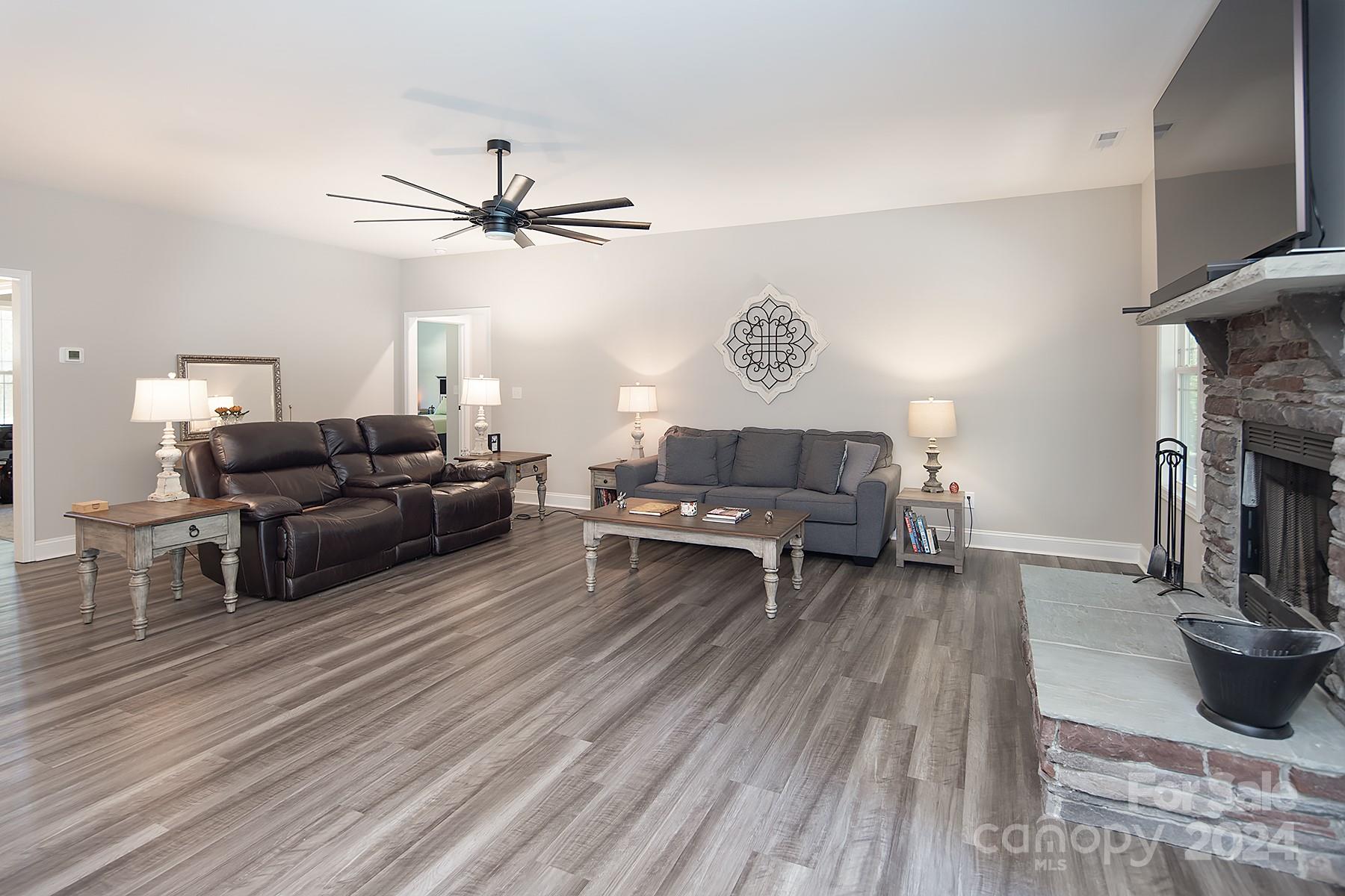 3000 Penninger Road Concord, NC 28025 - Photo 22 of 48 a living room with furniture and a fireplace