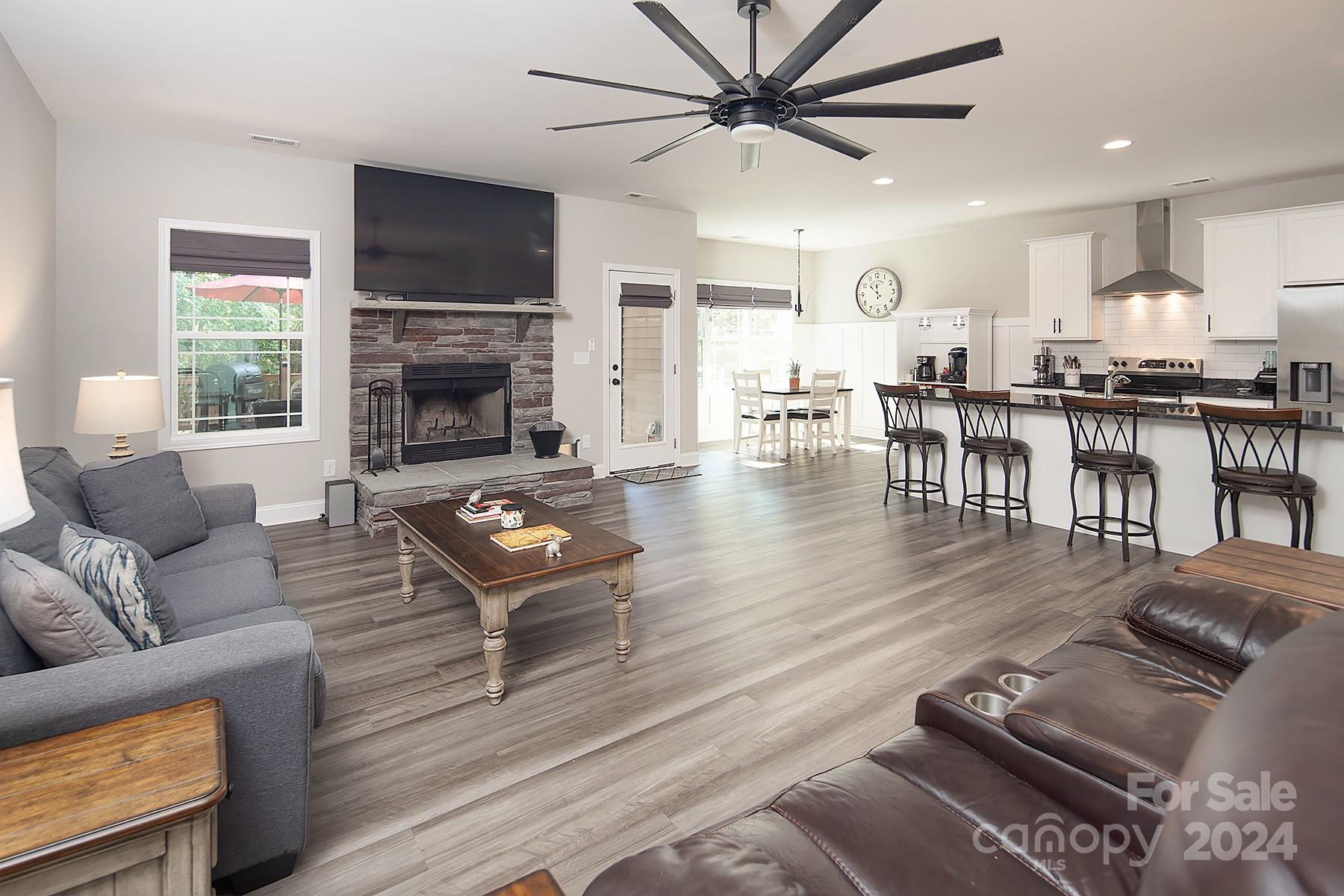 3000 Penninger Road Concord, NC 28025 - Photo 25 of 48 a living room with furniture and a fireplace
