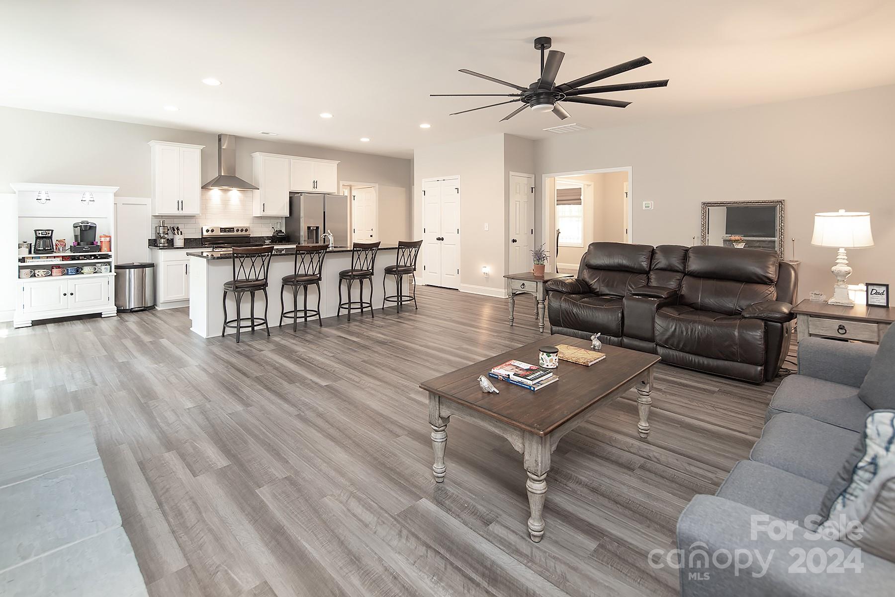 3000 Penninger Road Concord, NC 28025 - Photo 27 of 48 a living room with furniture and kitchen view
