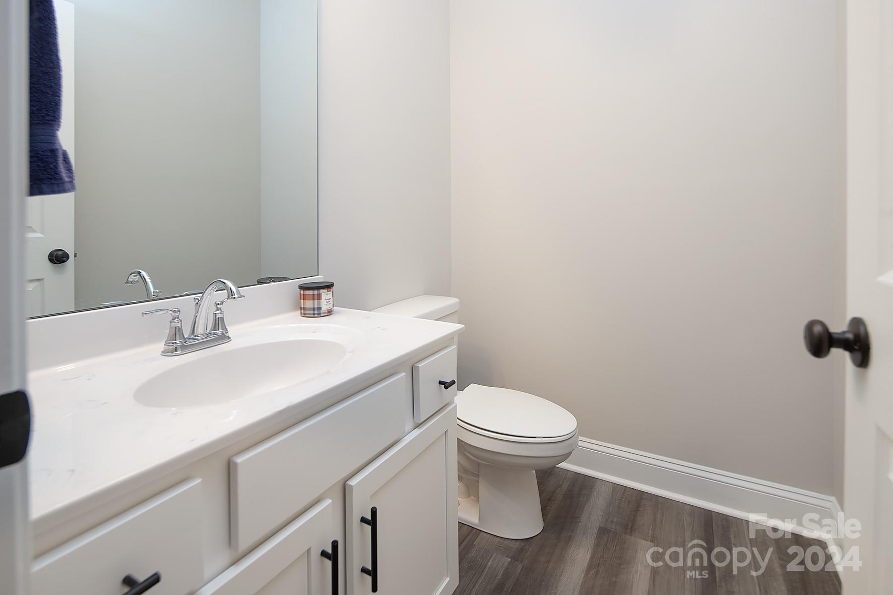 3000 Penninger Road Concord, NC 28025 - Photo 28 of 48 a bathroom with a sink toilet and a mirror